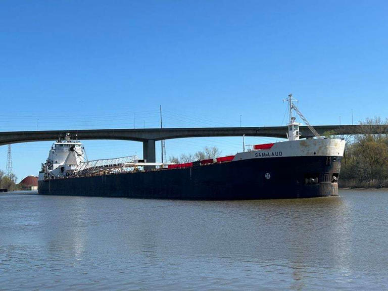 The M/V Sam Laud, a self-discharging freighter, is seen sailing on the Saginaw River, beneath the Zilwaukee Bridge, Sunday, April 21, 2024.