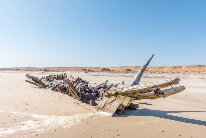 <p>Namibia’s Skeleton Coast is a hauntingly beautiful stretch of coastline littered with shipwrecks and bleached whale bones. This desolate landscape has an eerie, rugged, and captivating atmosphere, where winds howl and waves crash relentlessly. Discovering the secrets of the Skeleton Coast is a testament to the raw power of nature.</p>