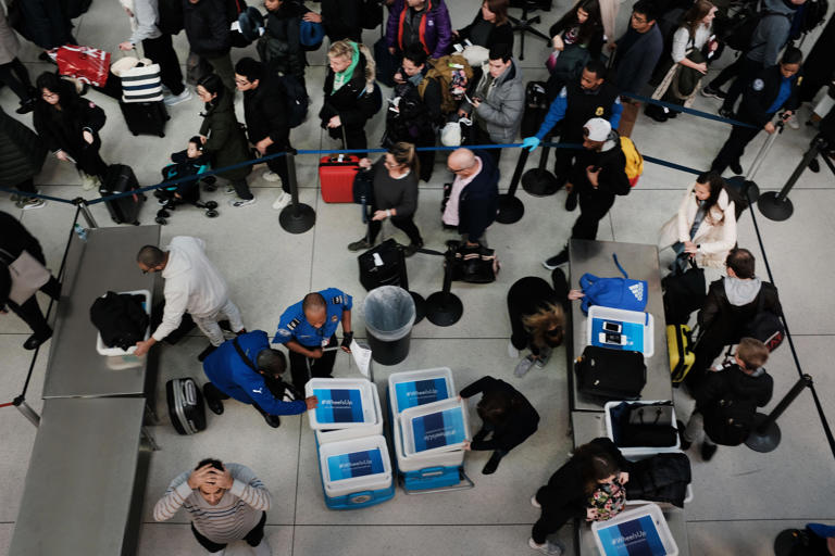 Passengers wait in a Transportation Security Administration line at JFK airport, Jan. 9, 2019, New York City.