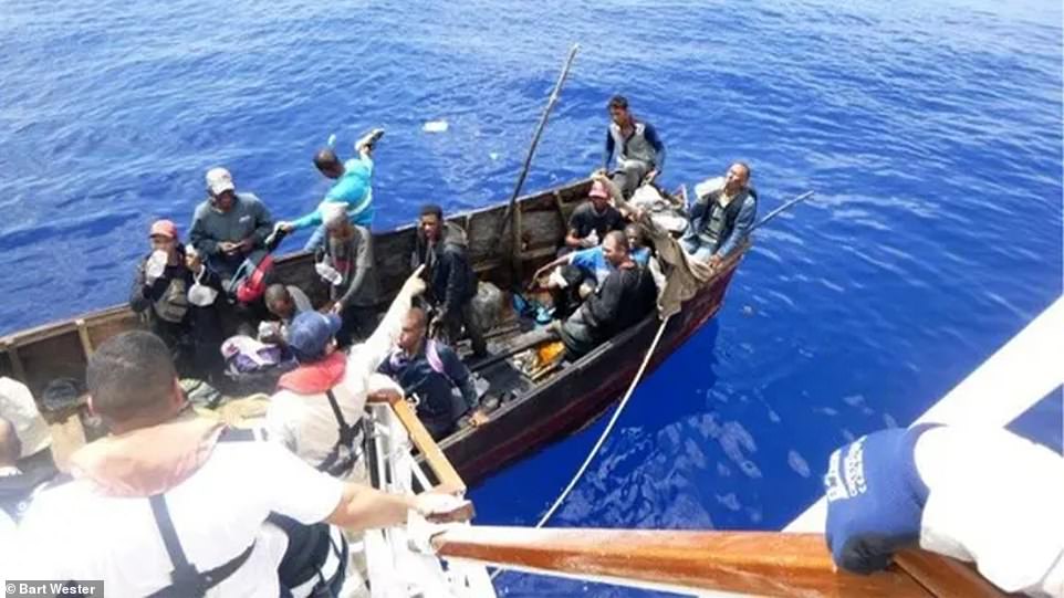 A Carnival Cruise Line ship has rescued over two dozen migrants off the coast of Cuba after they signaled for help from a tiny wooden craft. The cruise liner diverted its course on Sunday after crew aboard the vessel spotted a group of 27 migrants seeking help around 20 miles off Cuba.