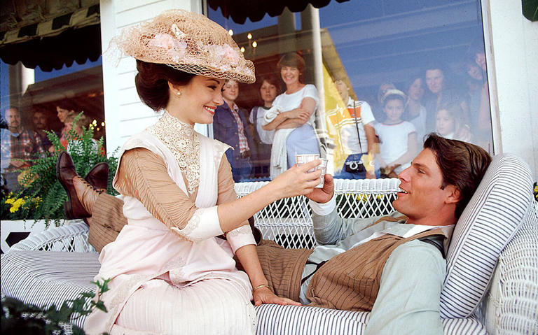 Actress Jane Seymour and Actor Christopher Reeve take a break during filming of 'Somewhere in Time' on the veranda of the Grand Hotel in Mackinac Island, Michigan in May, 1979.