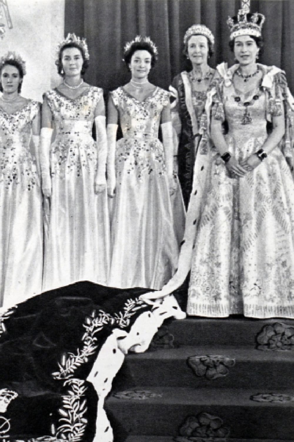 <p>                     Queen Elizabeth II has a Mistress of the Robes and the six Maids of Honour to assist her during her coronation. They carried her long train as she walked down the aisle - much like a wedding. They also wore dresses designed by Norman Hartnell, who crafted the Queen's elaborate gown.                    </p>