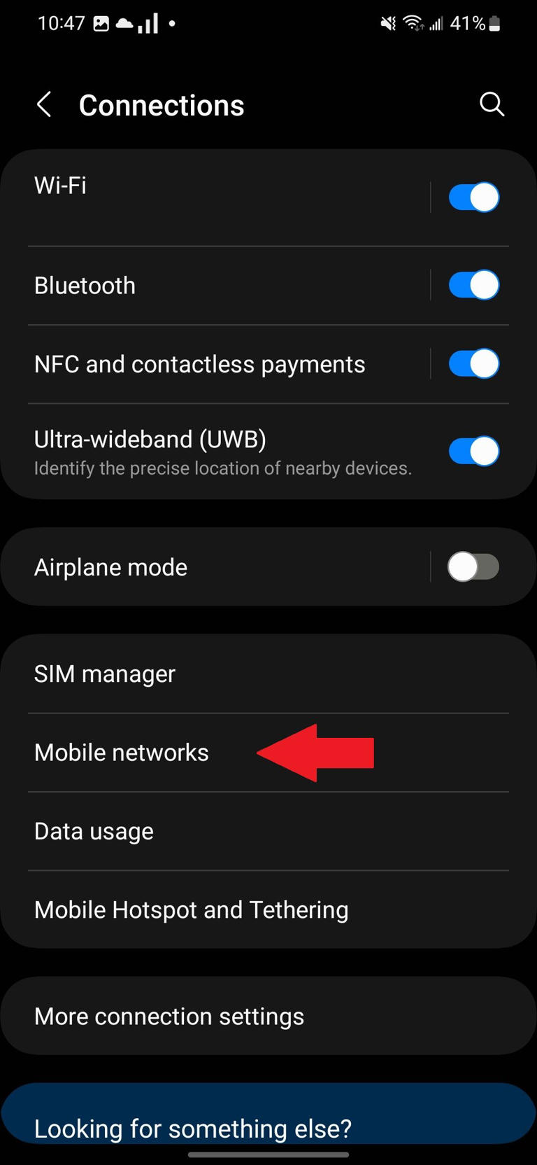 The Connections section in the Samsung Settings app with a red arrow pointing to the Mobile Networks option