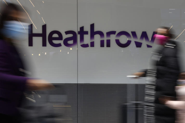 Travellers pass through the international arrivals gate at Terminal 5. A record 18.5 million passengers passed through Heathrow in the first quarter of 2024. Getty Images