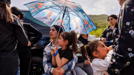 Armenia has agreed to hand back four border villages to Azerbaijan, prompting protests from nearby residents