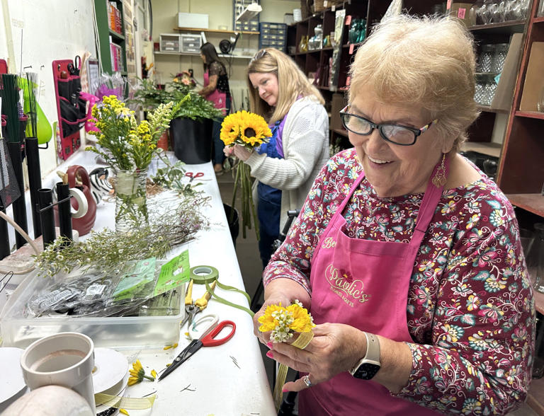 Becky Pavlic Edge has been creating beautiful flower arrangements for more than 50 years in Destin. Also pictured is Tammy Valentin and Victoria Worley.