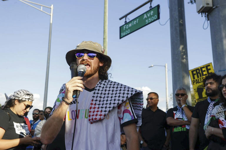 Cameron Pressey, one of 10 people arrested during a protest on the University of South Florida campus on Tuesday, speaks during a news conference and rally in support of Palestine off campus in Temple Terrace on Wednesday.