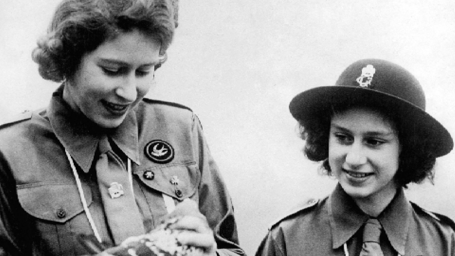 <p>                     Queen Elizabeth had plenty of hobbies growing up, from horse riding to art and music, and was an avid member of the Buckingham Palace Company of Girl Guides. This vintage photograph shows a young Princess Elizabeth in 1943 with her sister, Princess Margaret, holding a pigeon before sending it away with a message. Queen Elizabeth II was a patron of a number of different pigeon racing societies, including the Royal Pigeon Racing Association and the National Flying Club.                   </p>