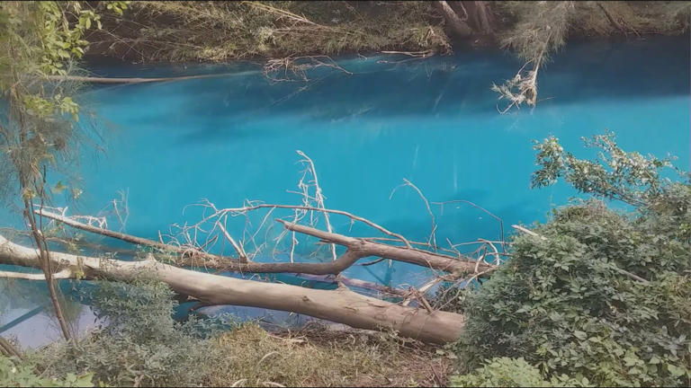 'Aqua blue' creek puzzles locals and authorities in Sydney's west