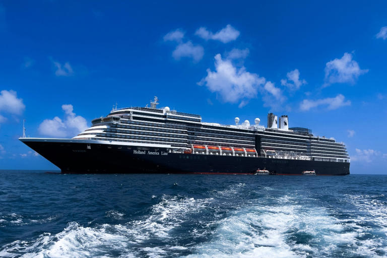 Holland America Line cruise ship sailing on the water during the day