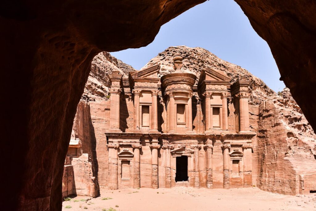 <p>Carved into sandstone cliffs, Petra was the capital of the Nabatean Kingdom and a crucial center for trade. Its intricate rock-cut architecture, including the famous Treasury (Al-Khazneh), showcases the Nabateans’ engineering skills.</p>
