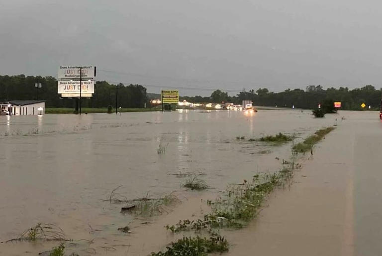 Severe flooding is seen on US Highway 59 near Choates Creek in Polk County.