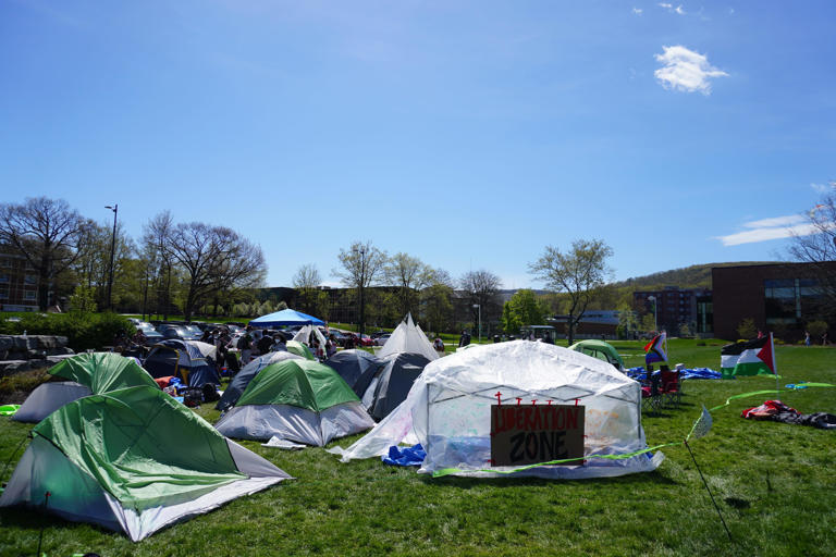 Binghamton University students gathered around tents set up on the campus Peace Quad Thursday, May 2, 2024.