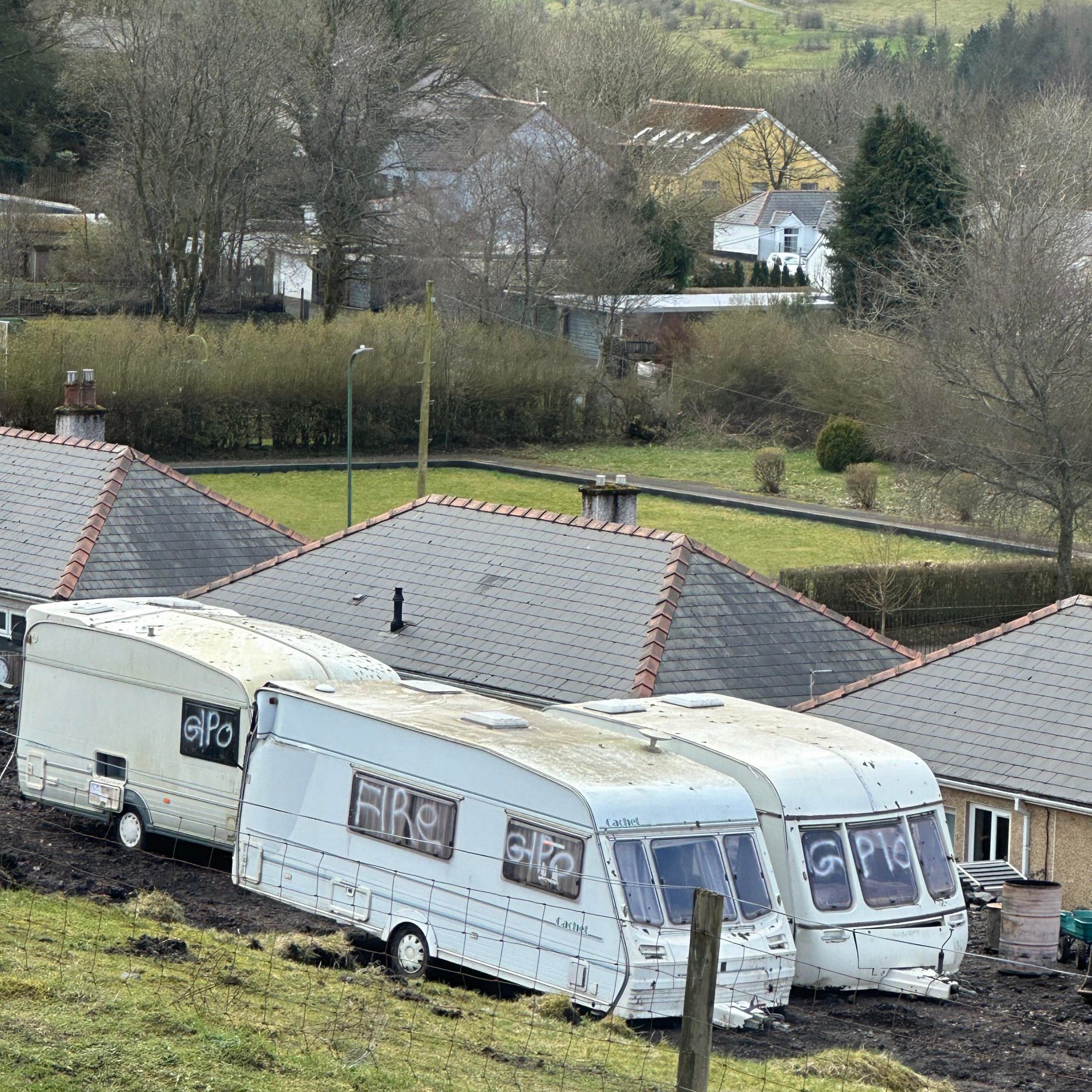 high court orders traveller families to stop digging out welsh hillside after residents feared landslip