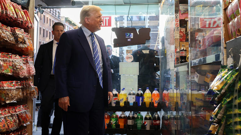 Former president Donald Trump talks with bodega owner Maad Ahmed during a visit to his store, Tuesday, April 16, 2024, in New York. AP Images