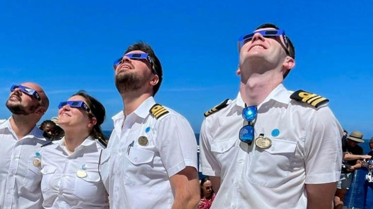 Princess Cruises officers view the solar eclipse.