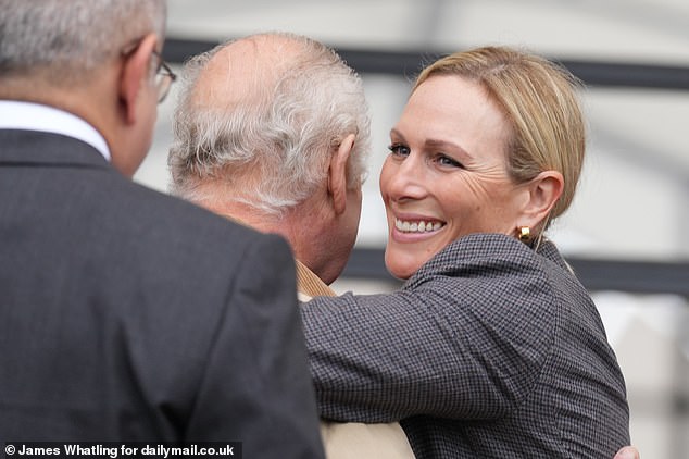 smiling king charles is embraced by zara tindall at windsor horse show