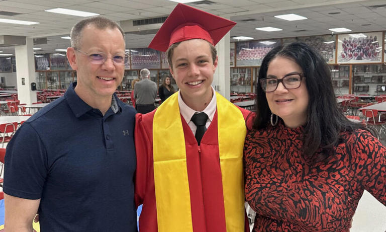 Sam Dodson with his parents, Sarah and Jeff, at the National Honor Society ceremony. (Sam Dodson)