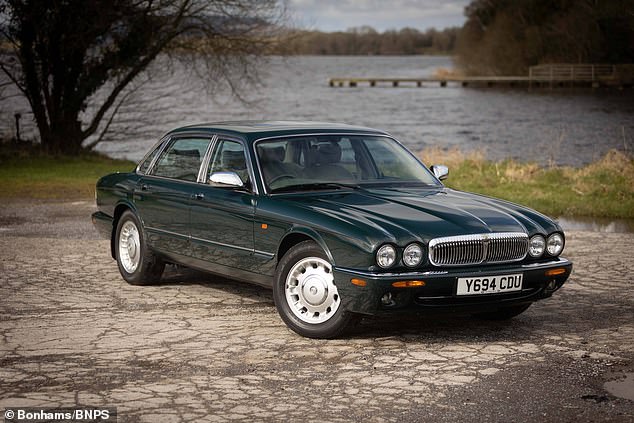 late queen's bespoke jaguar daimler sells at auction for £103,000