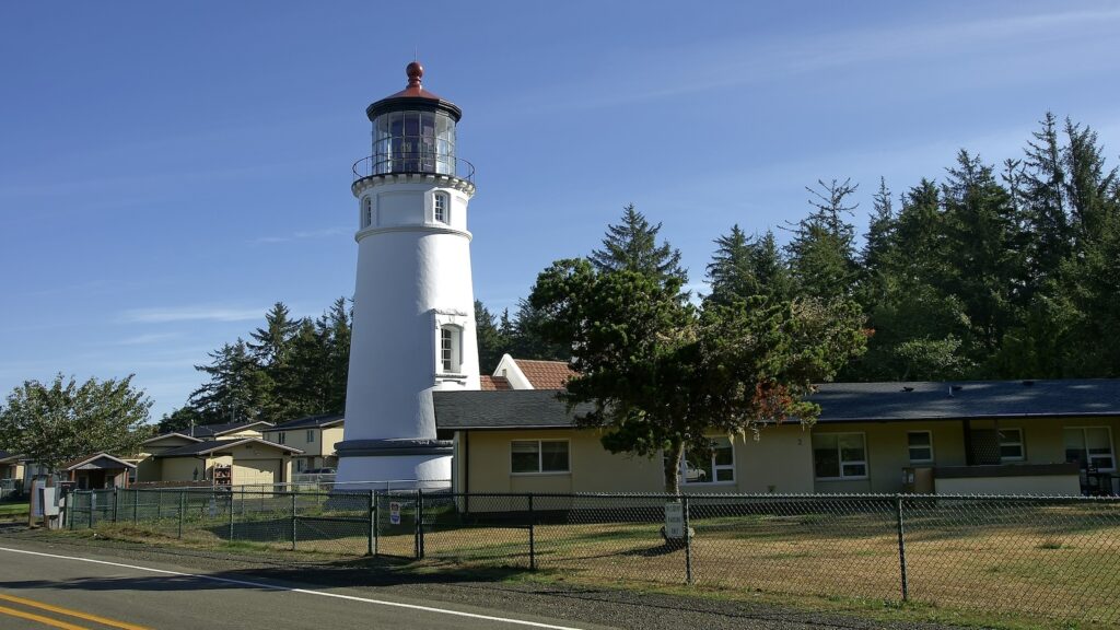 <p>The original Umpqua River Lighthouse was the first lighthouse built in Oregon. However, due to its lowland location along the Umpqua River, the land under the lighthouse eventually eroded away, and it collapsed. The new lighthouse was built on higher ground in the late 1800s, and it still stands today.</p><p>This lighthouse is unique in that it is not visible from the ocean, as its sole purpose was to guide ships through the Umpqua River.</p><p>The lighthouse is open to tours and is one of the few that allows visitors to climb to the top and see the light up close.</p>