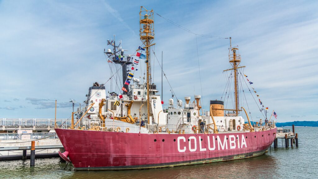 <p>The Lightship Columbia, docked outside of the Columbia River Maritime Museum in <a href="https://roamthenorthwest.com/things-to-do-in-astoria-with-kids/">Astoria, Oregon</a>, is unique in that it is a floating lighthouse that once patrolled the treacherous waters of the Columbia River Bar. The Graveyard of the Pacific, as it came to be known, is home to 100s of shipwrecks, including the infamous Peter Airedale. The lightship provided a navigational aid that could be adjusted based on the ever-shifting sands along the bar.</p><p>The ship was decommissioned in 1979 and is now open to tours with admission to the adjoining museum.</p>