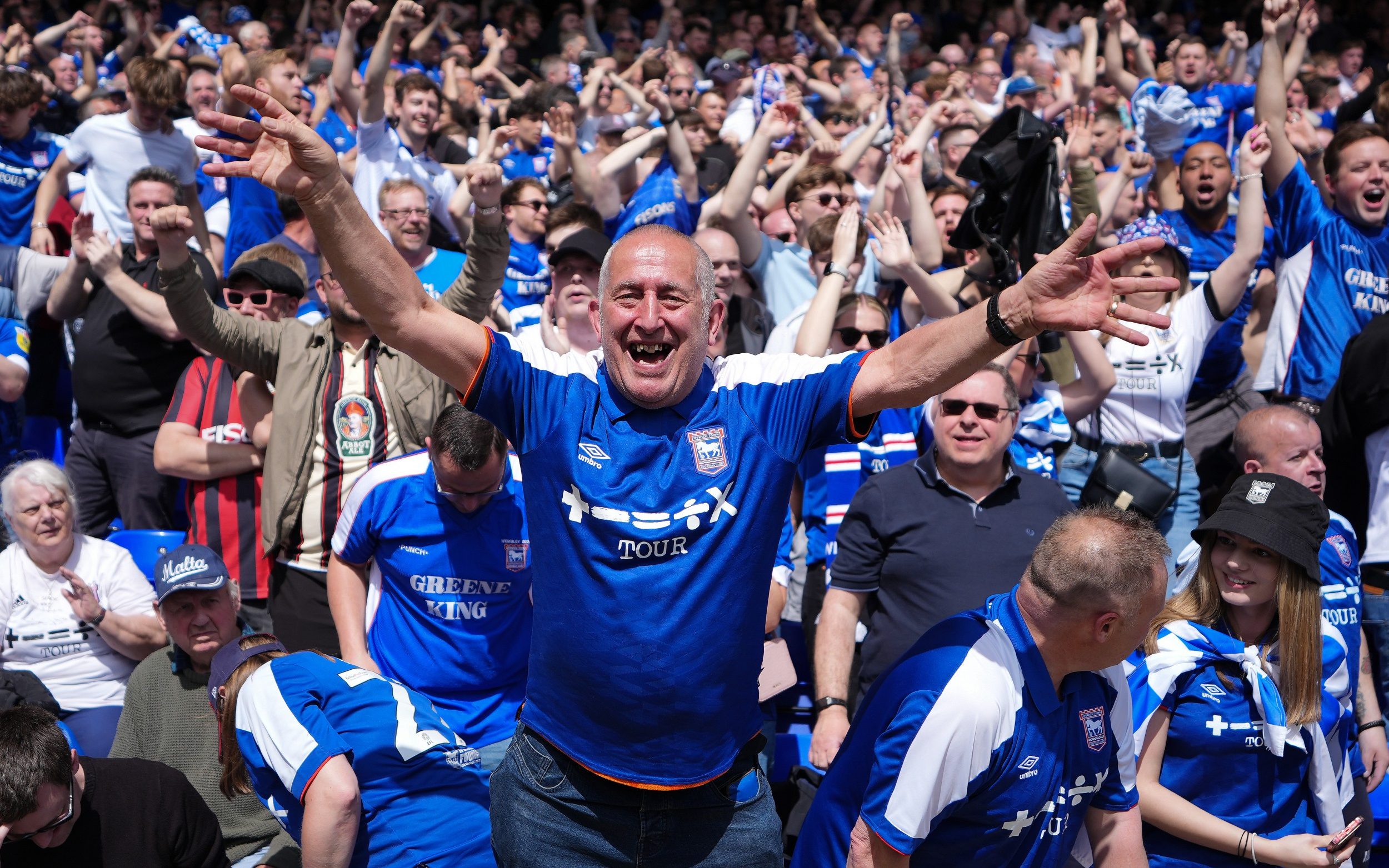 ipswich town fans invade pitch after winning promotion back to premier league
