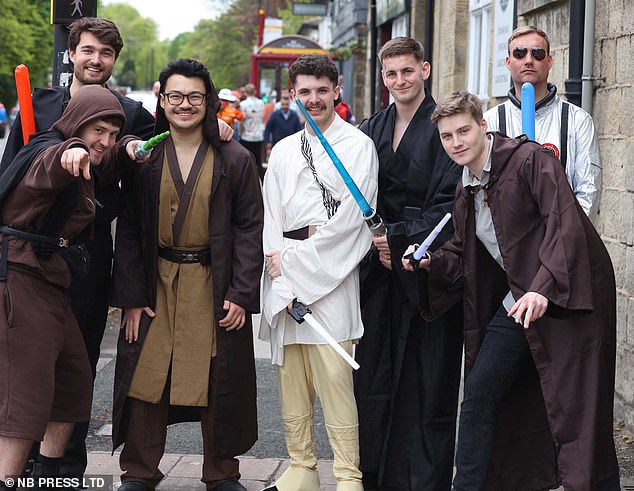 students dress up in sci-fi costumes for pub crawl on star wars day