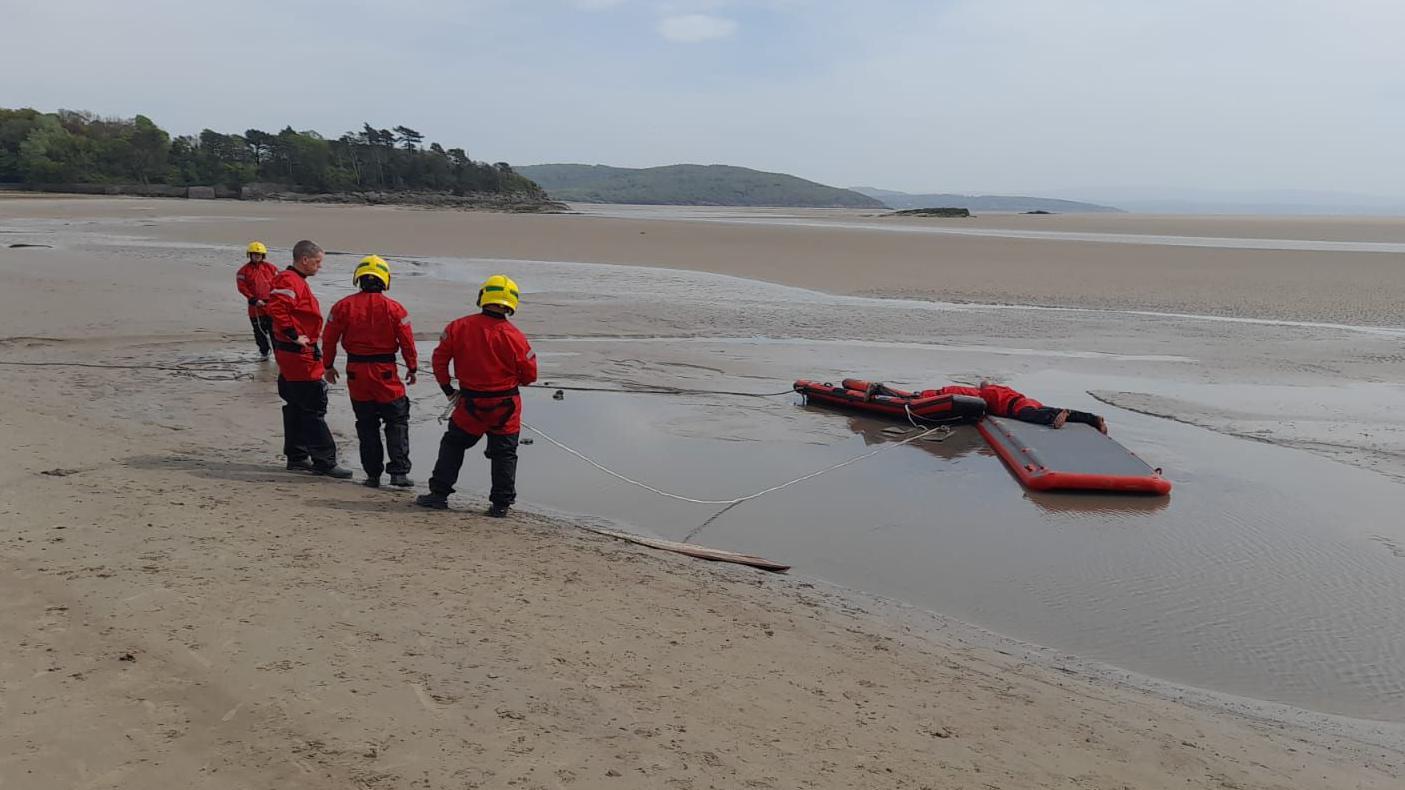 dog rescued after getting stuck in quicksand