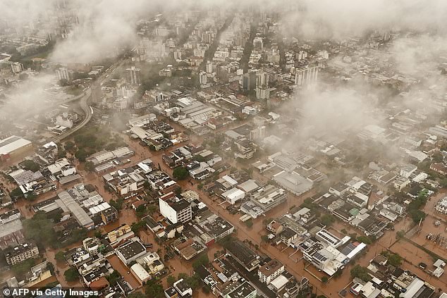 brazilians rescued from roofs as flood death toll rises to 57