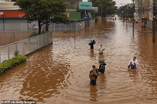 brazilians rescued from roofs as flood death toll rises to 57