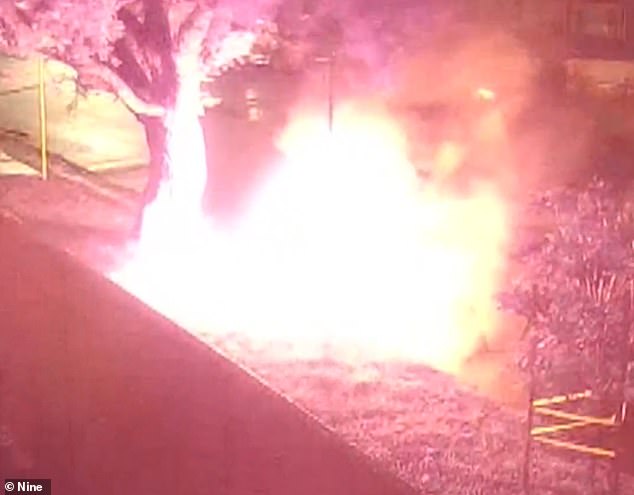 wild moment hooded figure lights fire that destroyed $400,000 mclaren