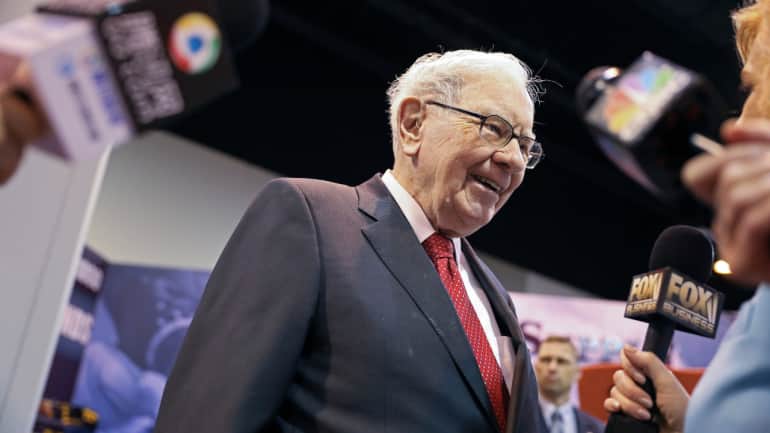warren buffett says ai genie out of the bottle, just like nuclear weapons; worried about scamming