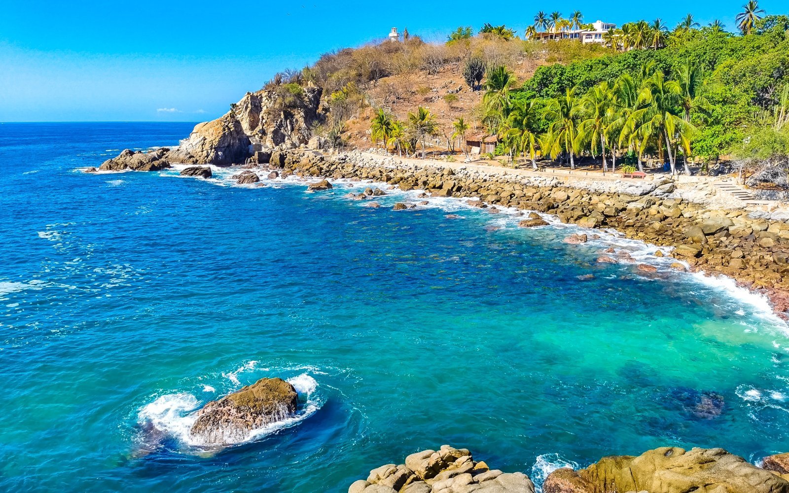 <p class="wp-caption-text">Image Credit: Shutterstock / Arkadij Schell</p>  <p>Escape to the land of tacos and tequila and discover the hidden gem of Puerto Escondido. With its heavy beach breaks and pumping swells, this epic spot is not for the faint of heart. Whether you’re charging the shore break or getting pitted in the barrel, Puerto Escondido offers up endless waves and endless stoke.</p>