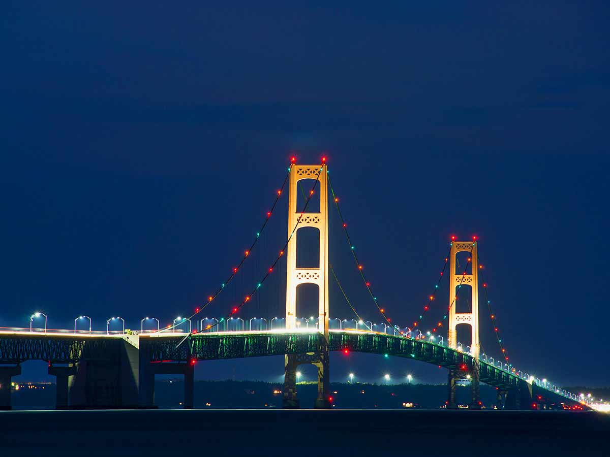 <p>A bridge may just be a way to get from point A to point B, but if you build them big and elaborate enough, they're likely to turn into a full-blown tourist destination. That's the case with Michigan's Mackinac Bridge—which brings in almost 10 million visitors per year. </p> <p>The majestic Mackinac bridge connects the beauty of Michigan's Lower and Upper Peninsulas in a way like no other. Its opening in 1957 has since then publicized its grand reputation to bring people from all around the world flocking to its grounds. Stretching across 5 miles, it's become recognized as something of a hallowed pilgrimage ground for modern day bridge pilgrims alike!</p> <p>Missing out on experiencing its beautiful sight would be like cheating yourself out of petting an alpaca at the petting zoo! While tourists traveling up north to visit Mackinac Island are widely aware joys it offers, this tpoetic piece of architecture also draws admirers from all corners of the earth!</p>