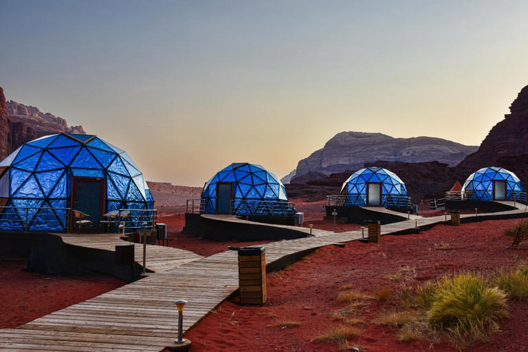 geodome accommodations in the desert during sunset