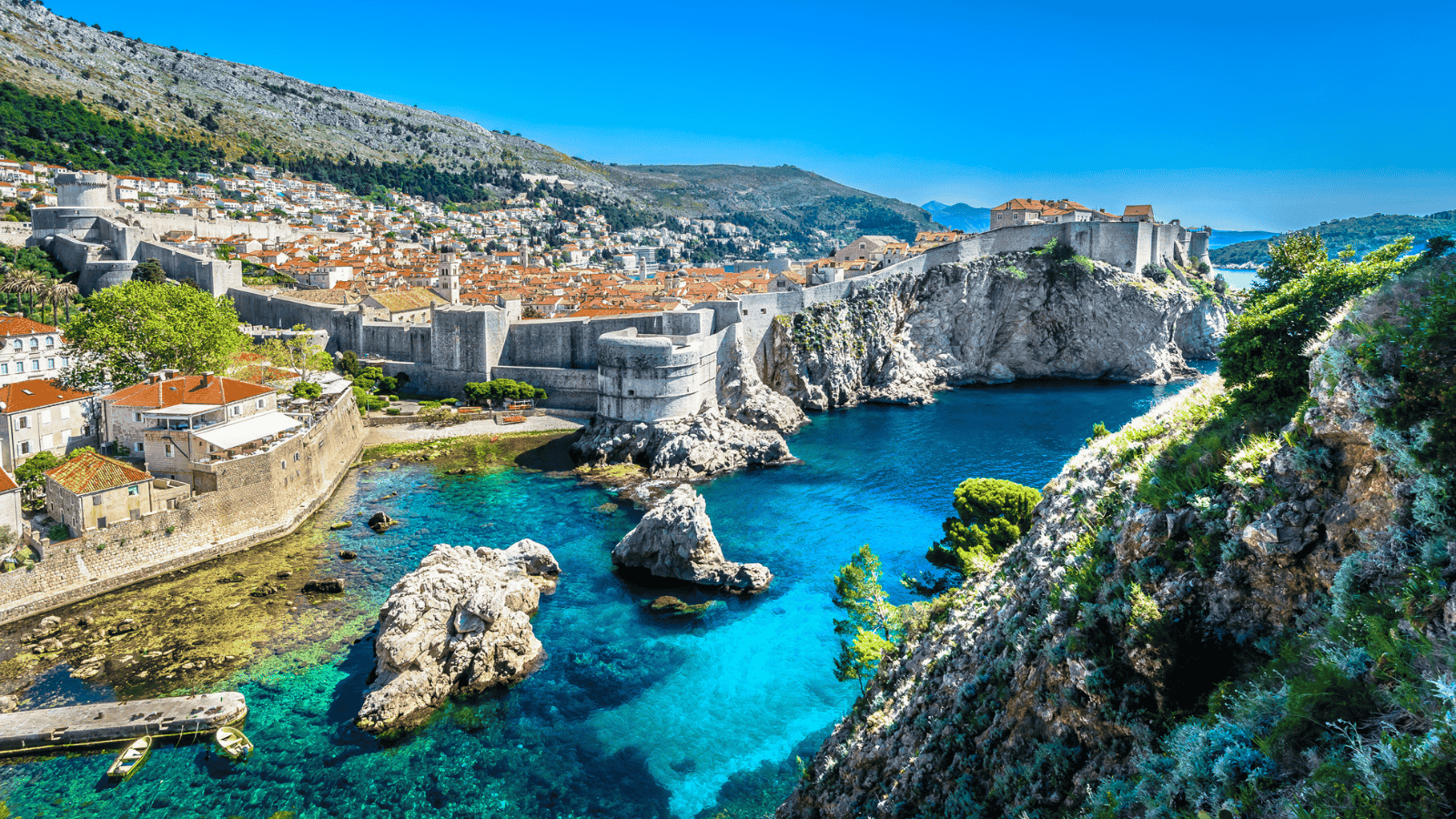 <p>Croatia is a fantastic summer getaway for budget-conscious travelers. Its location on the Adriatic Sea is famous for its vibrant coastlines and rich cultural heritage. A road trip down the coast will allow you to tour <a href="https://whatthefab.com/bucket-list-unesco-world-heritage-sites.html" rel="follow">UNESCO World Heritage Sites</a>, dine on fresh local cuisine, and enjoy the scenic waterfront views. Add Split and Dubrovnik to your sightseeing itinerary for low-cost activities like wandering the city plazas and enjoying the public beaches. </p>