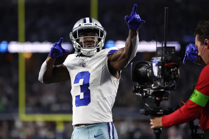 dallas cowboys' brandin cooks flying above competition