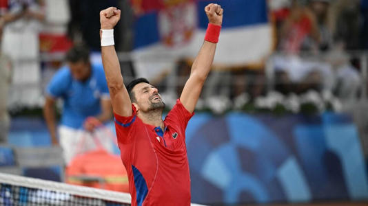 Paris Olympics: Serbia's Novak Djokovic celebrates beating Italy's Lorenzo Musetti during their men's singles semi-final tennis match on Court Philippe-Chatrier at the Roland-Garros Stadium during the Paris 2024 Olympic Games, in Paris on August 2, 2024. (Photo by AFP)