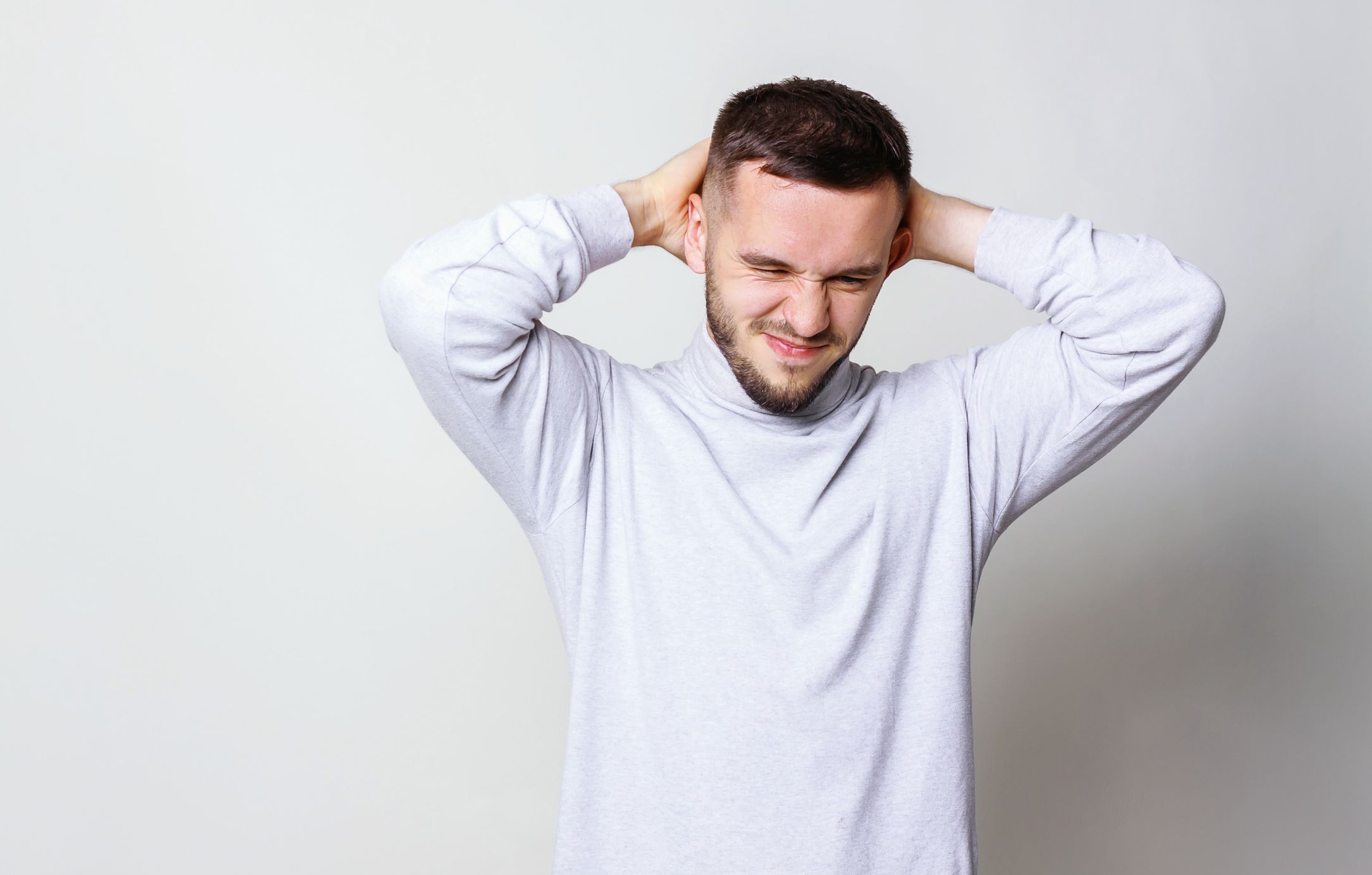 What causes a headache at the back of the head?