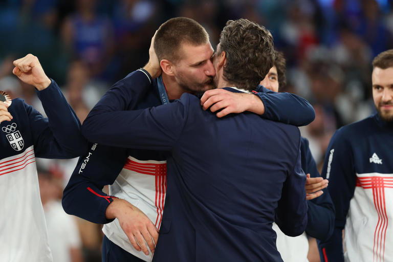 PARIS, FRANCE - AUGUST 10: Bronze medalist Nikola Jokic of Team Serbia hugs former NBA player Pau Gasol on the podium during the Men's basketball medal ceremony on day fifteen of the Olympic Games Paris 2024 at Bercy Arena on August 10, 2024 in Paris, France. (Photo by Gregory Shamus/Getty Images) ORG XMIT: 776138674 ORIG FILE ID: 2166242014