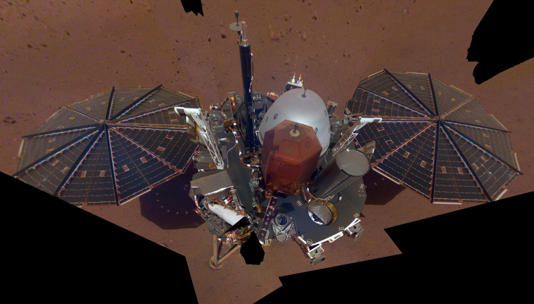 NASA InSight's first full selfie on Mars. It displays the lander's solar panels and deck. On top of the deck are its science instruments, weather sensor booms and UHF antenna. The selfie was taken on Dec. 6, 2018 (sol 10). The selfie is made up of 11 images which were taken by its Instrument Deployment Camera, located on the elbow of its robotic arm. Those images are then stitched together into a mosaic. Credit: NASA/JPL-Caltech