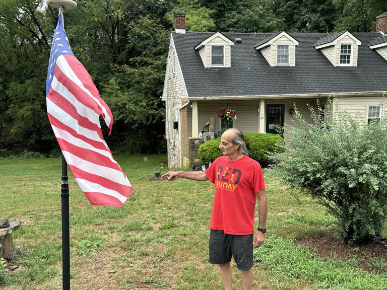 Ray Langeheine recently purchased the house owned by Jacob Altland in 1863, the site where a delegation from York surrendered the town to the Confederates. Langeheine, seen here, flies the flag on land around his farmhouse in which Confederates camped in June 1863, the night before they entered York.