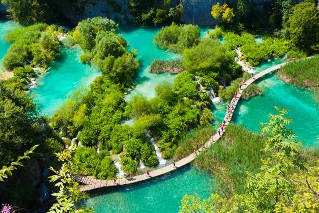 Tourists go on special tracks around the lake