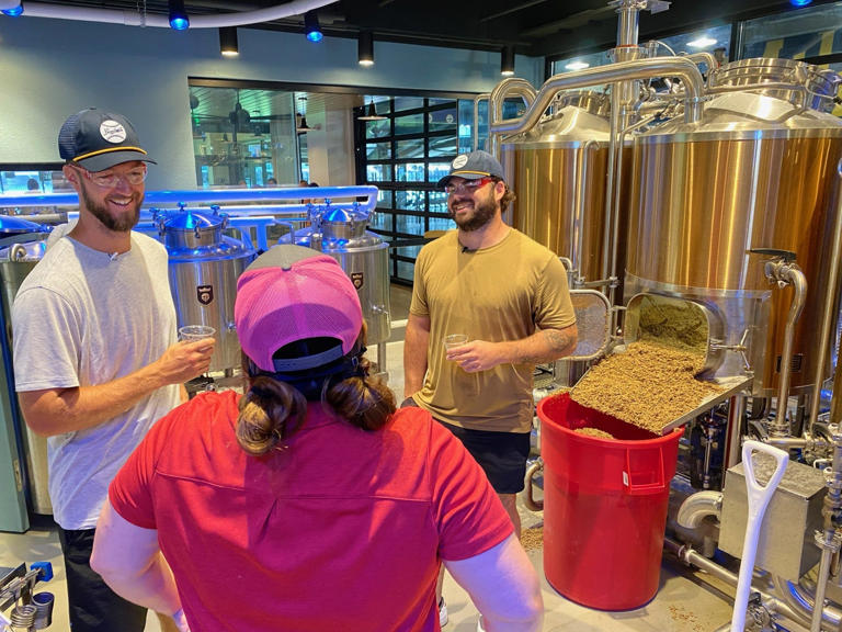 On Aug. 14, 2024, Milwaukee Brewers pitchers Colin Rea and Bryse Wilson learned about the brewing process from Corrine Georges, pilot brewer at J. Leinenkugel’s Barrel Yard.