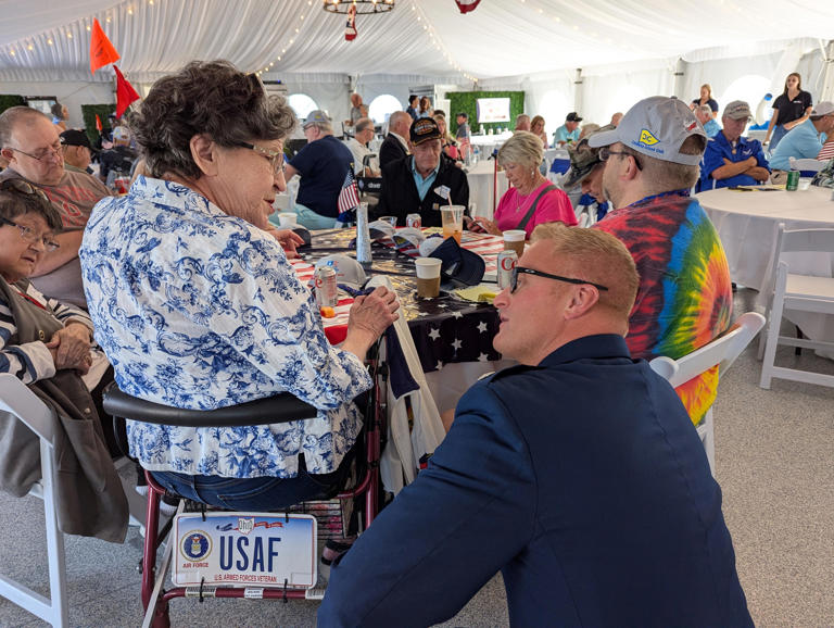 Pat Hansen, who was a nurse with the Air Force during the Vietnam era, visits with guest speaker Lt. Col. Jeffrey Capretto, USAF ret., during the 2024 Voyage for Veterans, which took place on Wednesday at the Catawba Island Club.