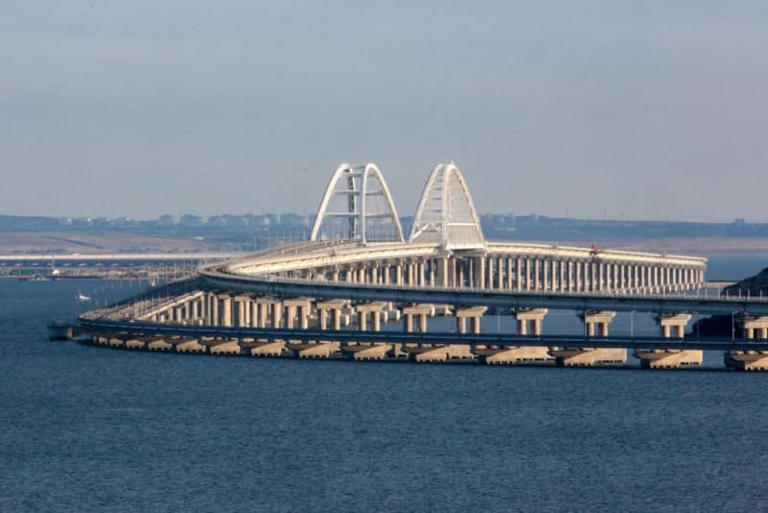 A view taken on Oct. 12, 2022, shows the Kerch Bridge that links Russian-occupied Crimea to Russia, near Kerch, which was hit by a blast on Oct. 8, 2022. (Photo by Stringer/AFP via Getty Images)