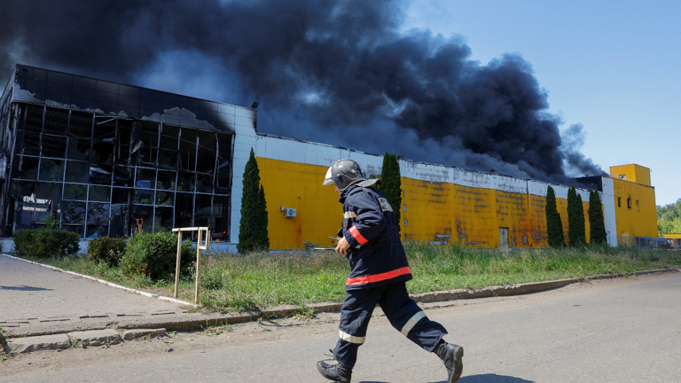 Smoke rises above the burning shopping centre in Donetsk