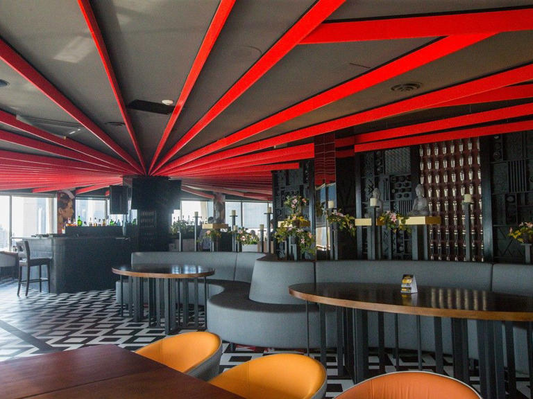 The interior of downtown Windsor's 14th-floor Republik Asian Eatery and Bar, shown July 6, 2024, showcases the bold reds, blacks, and golds signature to Hong Kong design style.