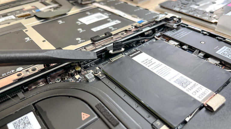 Some connectors are easy to move, like this webcam cable, but others require careful application of force. (Image credit: Future)