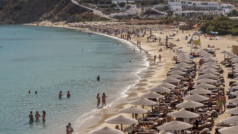 Visitors at Kalo Livadi Beach in Mykonos, Greece. Getty Images